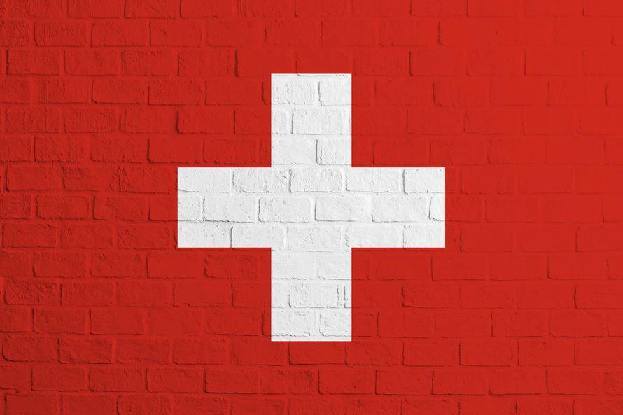 Flag of Switzerland. Brick wall texture of the flag of Switzerland