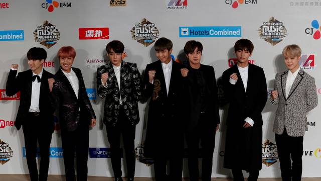 FILE PHOTO: Members of South Korean K-pop band BTS pose during Mnet Asian Music Awards in Hong Kong