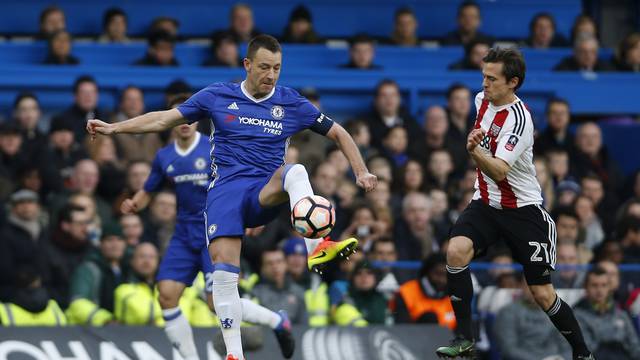 Chelsea's John Terry in action with Brentford's Lasse Vibe