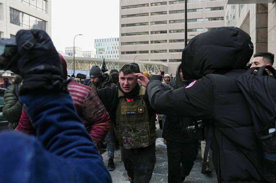 People attend the "March Against Minnesota Fraud" in Minneapolis