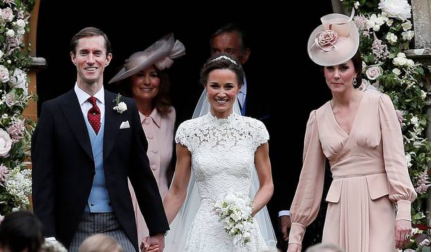 Pippa Middleton and James Matthews smile as they are joined by Britain