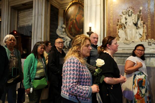People queue to visit the tomb of the late Pope Francis in the Papal Basilica of Saint Mary Major (Santa Maria Maggiore), in Rome