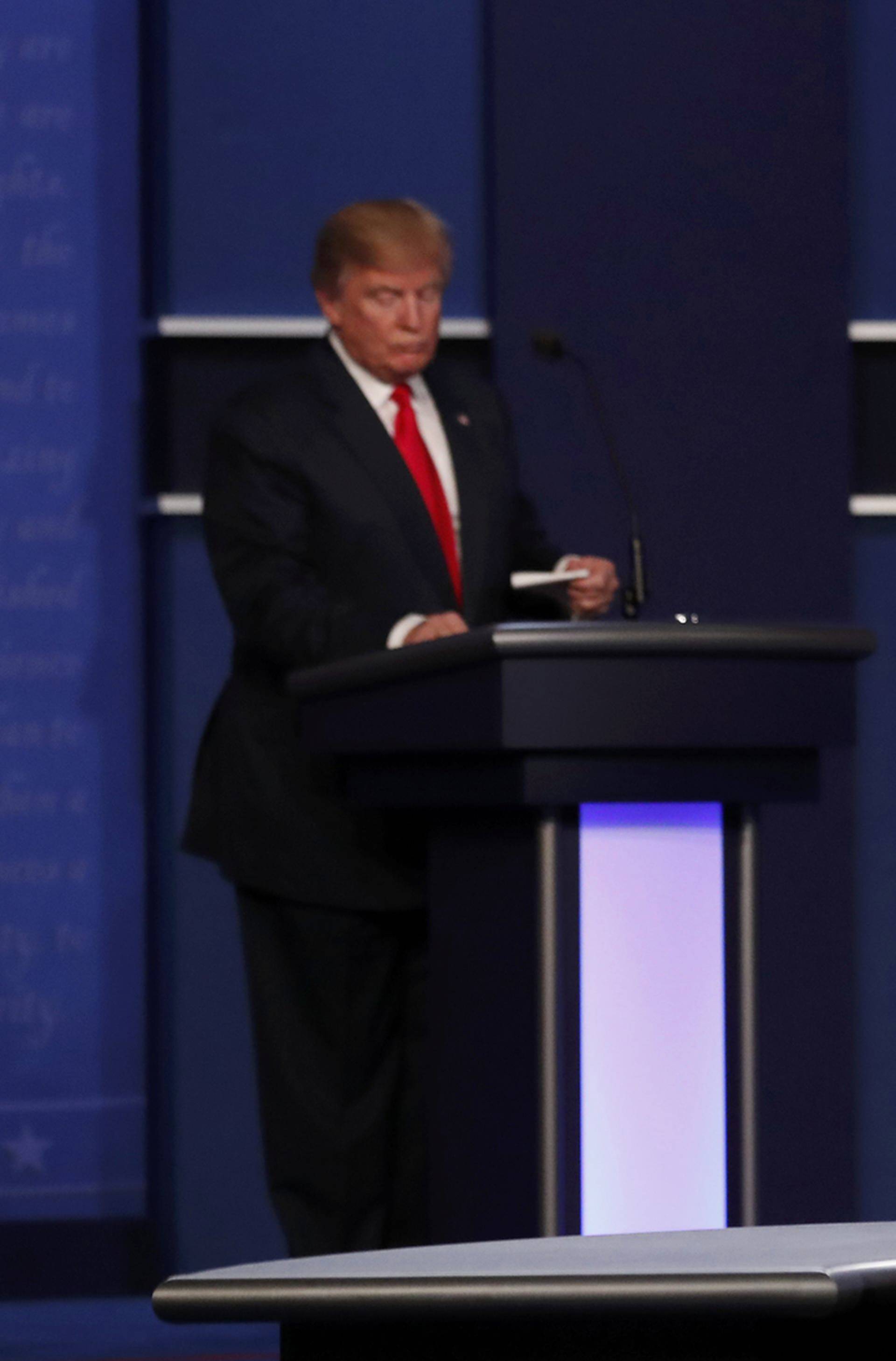 Republican U.S. presidential nominee Donald Trump and Democratic U.S. presidential nominee Hillary Clinton finish their third and final 2016 presidential campaign debate at UNLV in Las Vegas