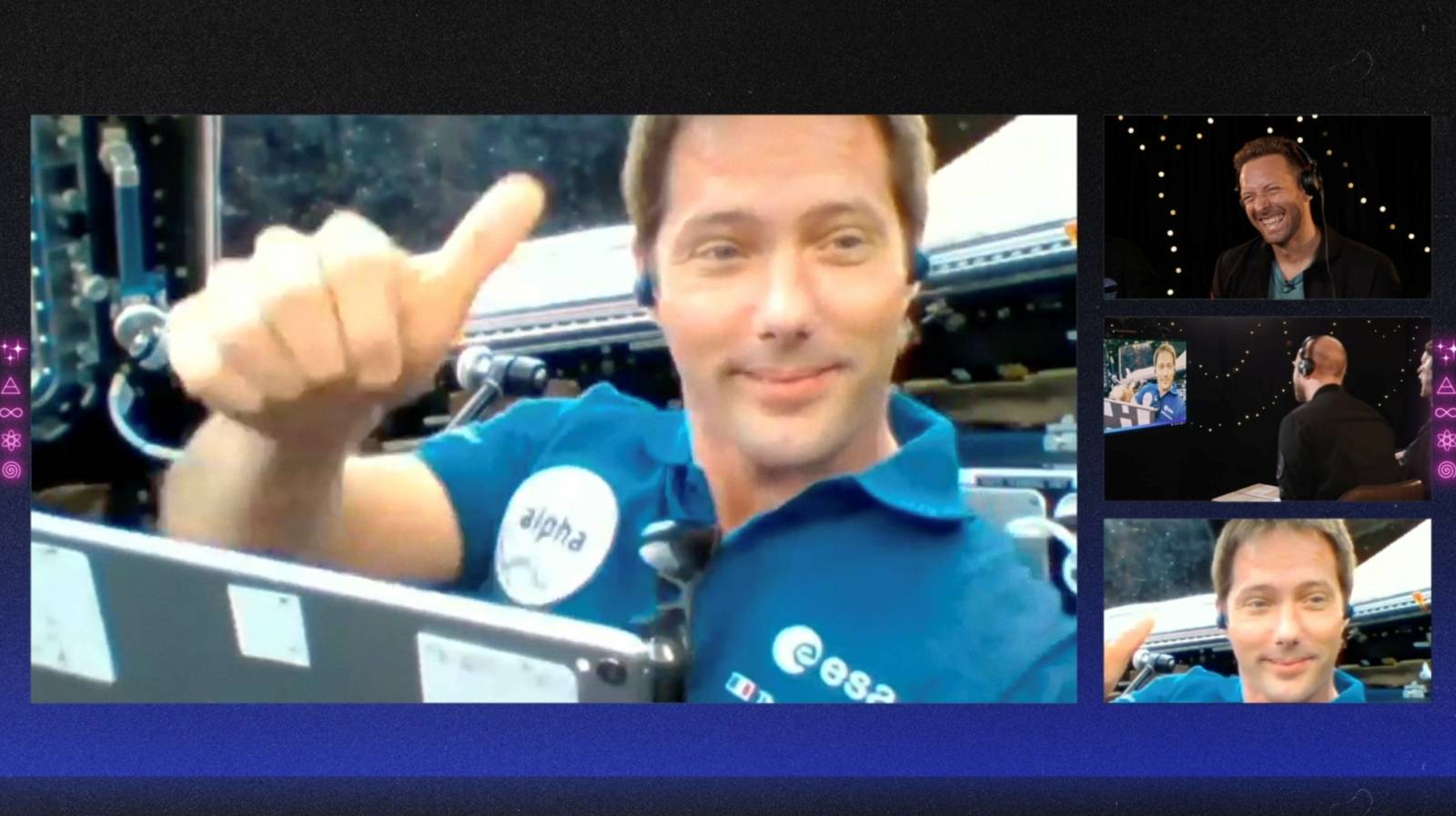 French ESA astronaut Thomas Pesquet gestures during an interview with members of Coldplay