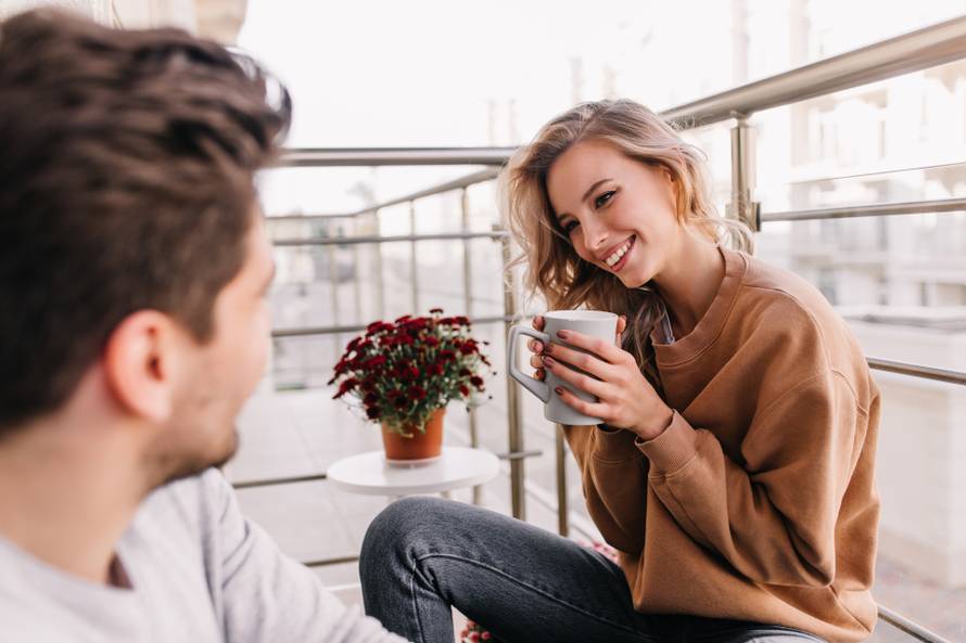 Stunning,Girl,With,Curly,Hairstyle,Drinking,Coffee,At,Balcony.,Photo