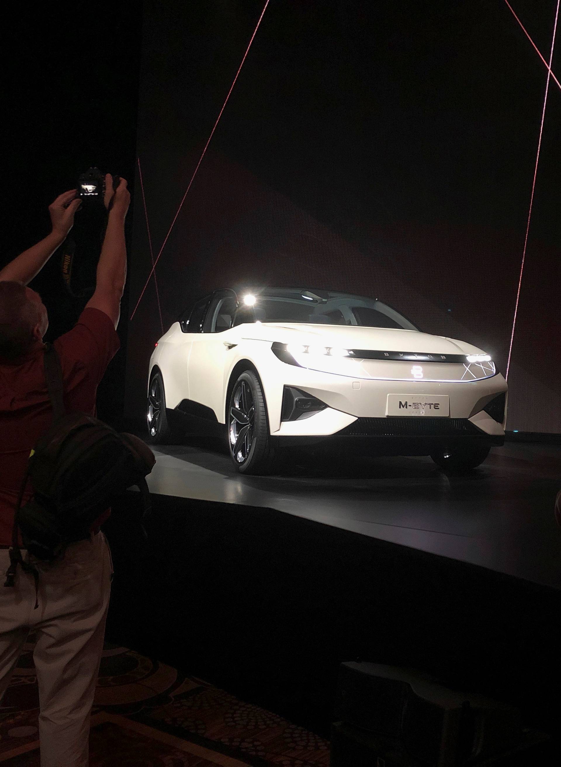 Photographers gather around Byton's electric M-Byte vehicle during the 2019 CES in Las Vegas