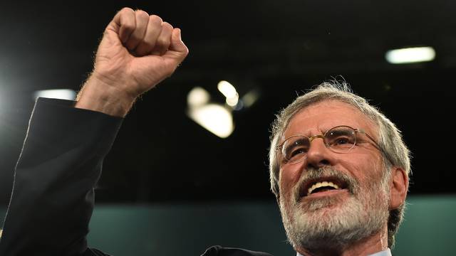 Sinn Fein President Gerry Adams gestures after delivering a speech at his party's annual conference in Dublin