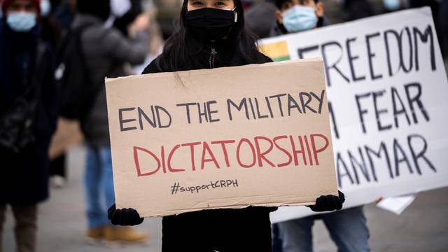 People attend a protest against the military coup in Myanmar, at Town Hall Square in Copenhagen