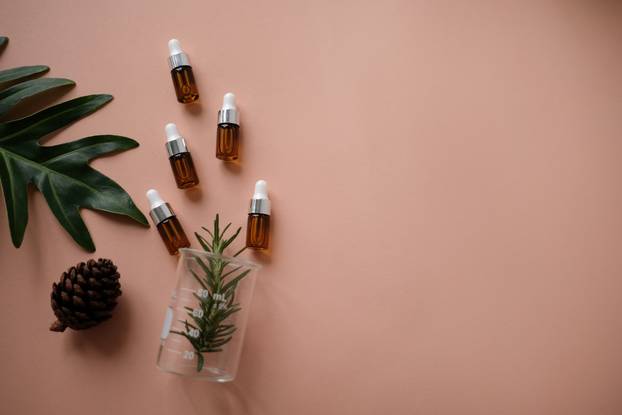 natural cosmetic cream , serum, skincare blank bottle packaging with leaves herb, wood . bio organic product.beauty and spa concept.