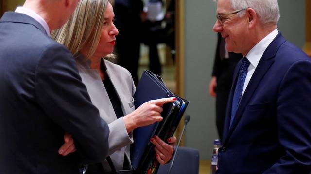 EU foreign policy chief Mogherini talks to Poland's Foreign Minister Czaputowicz during EU foreign ministers meeting in Brussels