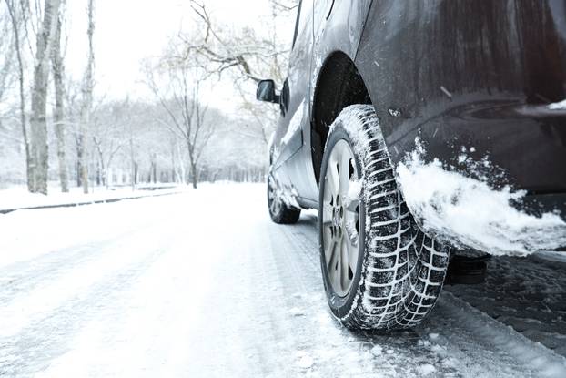 Modern,Car,With,Winter,Tires,On,Snowy,Road