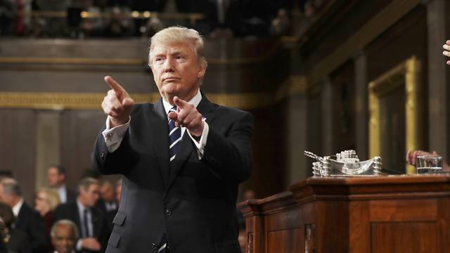 US President Trump reacts after delivering address to Joint Session of Congress in Washington