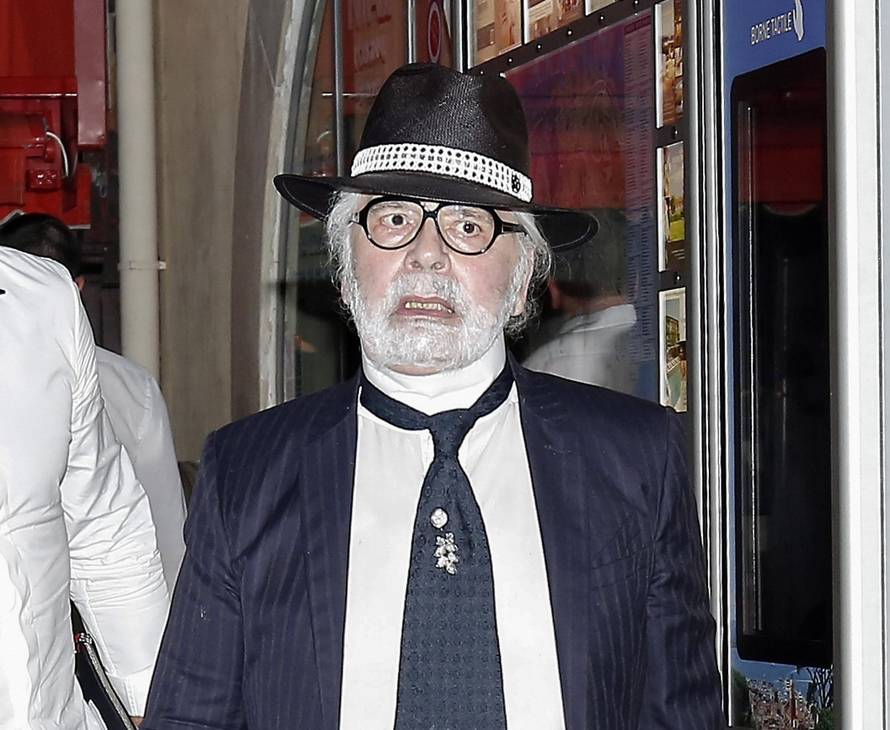 Karl Lagerfeld leaving Le Senequier in Saint Tropez