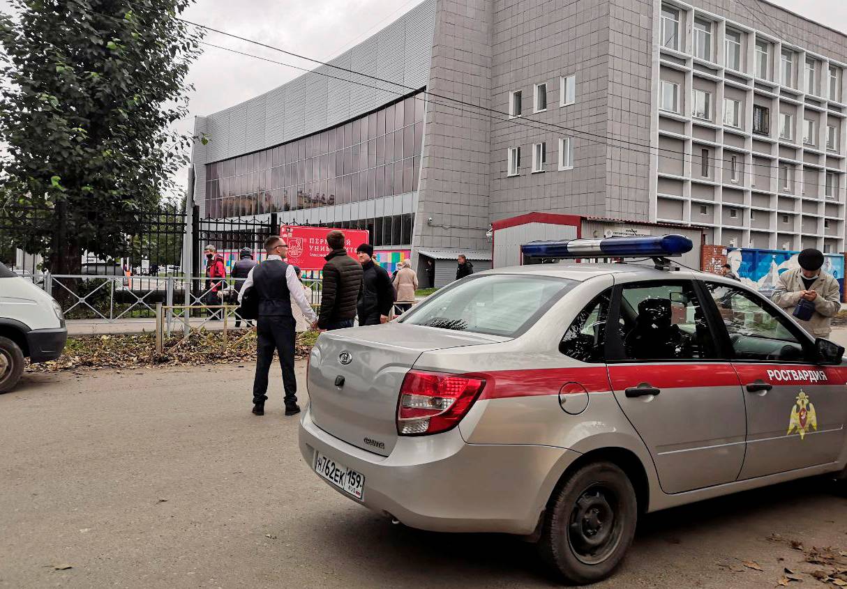 A car of Russia's National Guard is seen at the scene following a shooting at university in Perm