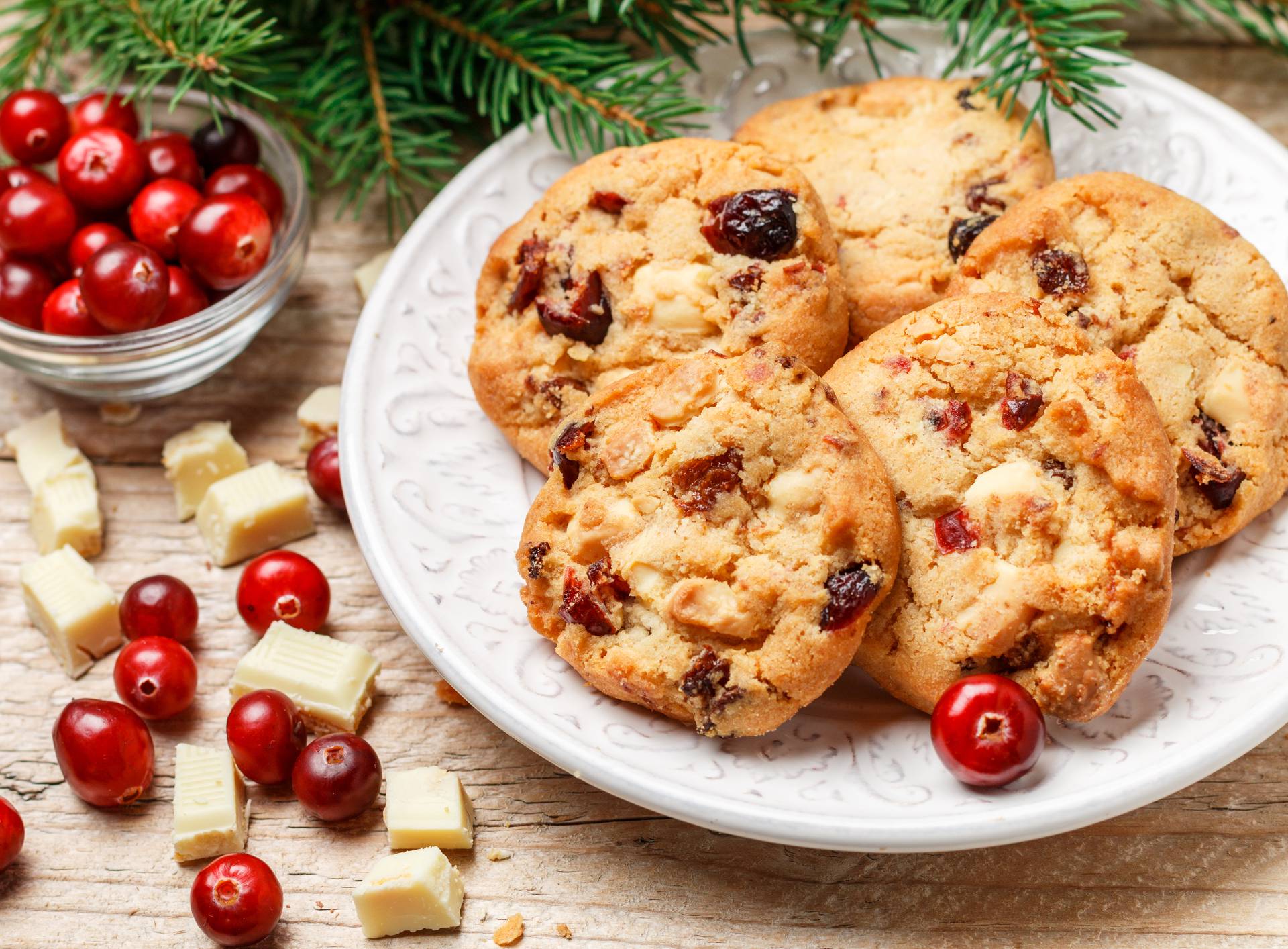 Homemade Christmas cranberry cookies with white chocolate in a bowl on the table. Rustic style. Selective focus