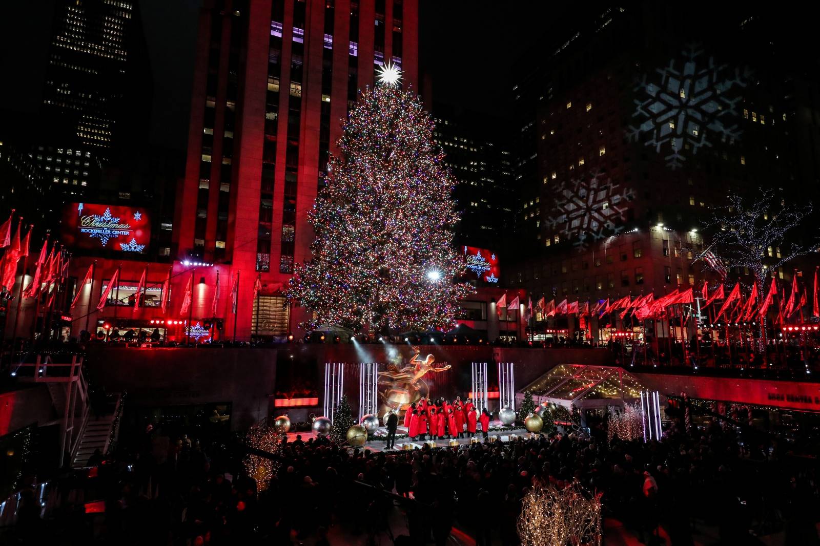 People watch the lighting of The Rockefeller Center Christmas Tree in New York City
