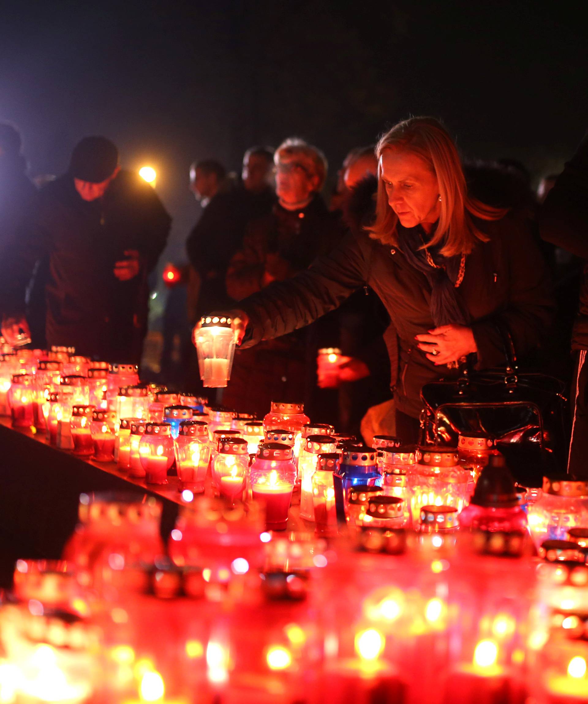 Bosnian Croats pray and light candles for the convicted general Slobodan Praljak, who killed himself seconds after the verdict in the U.N. war crimes tribunal in The Hague, in Mostar