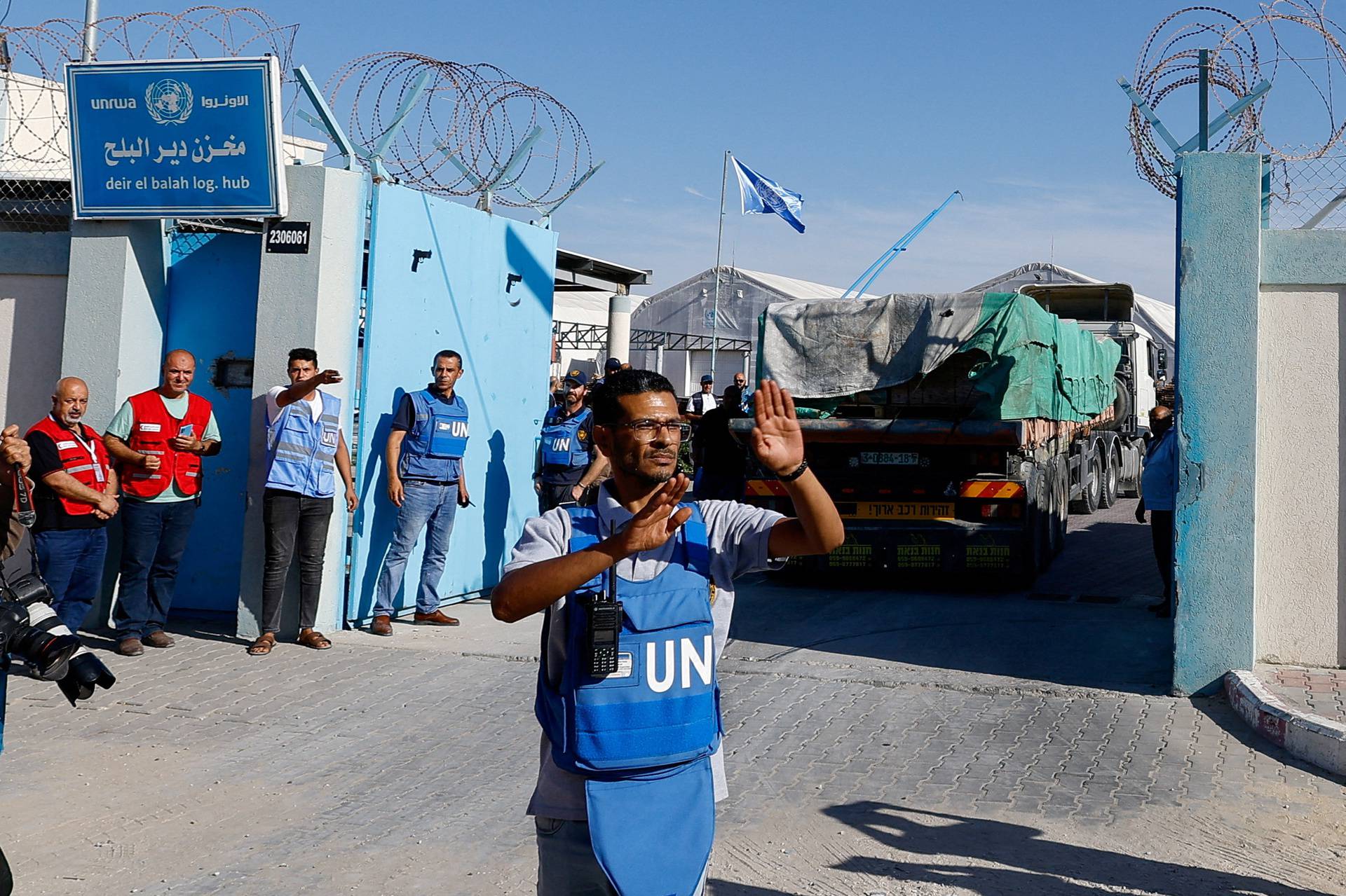 Aid trucks arrive at a UN storage facility in the central Gaza Strip