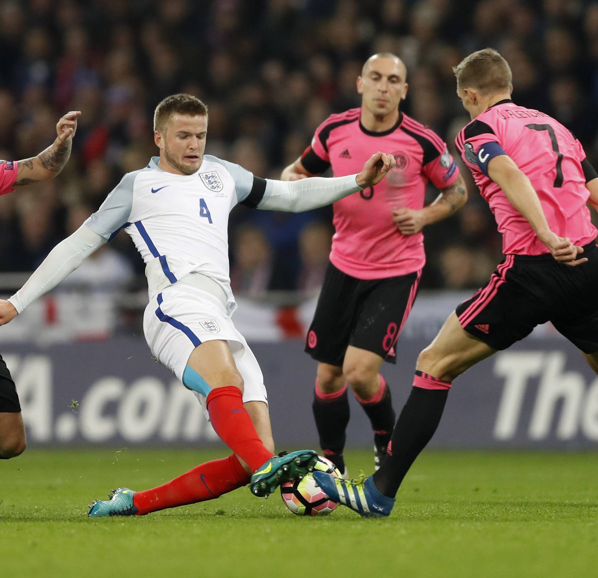 Scotland's Leigh Griffiths, Scott Brown and Darren Fletcher in action with England's Eric Dier