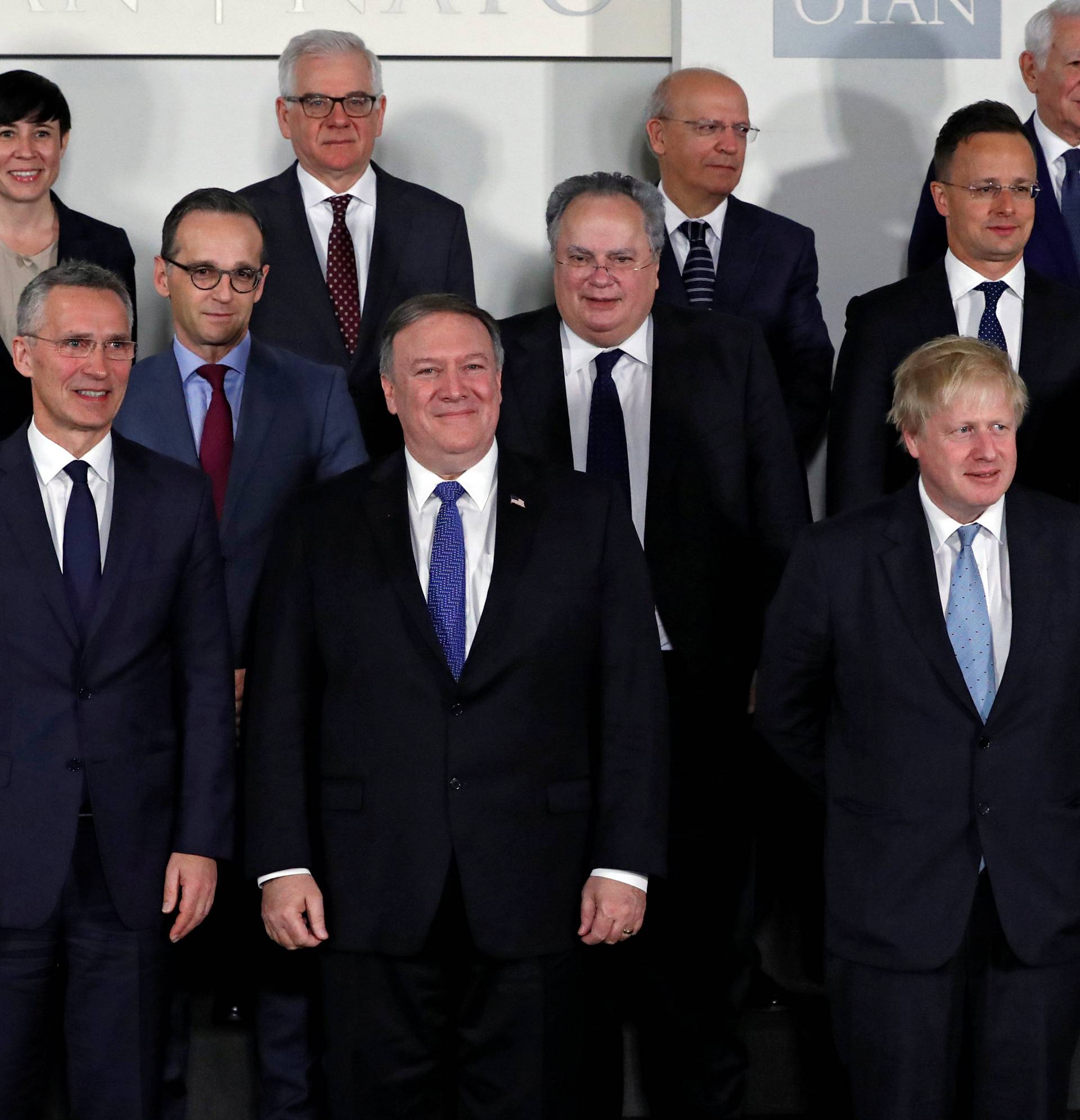 NATO Secretary General Stoltenberg, U.S. Secretary of State Pompeo and Britain's Foreign Secretary Johnson pose for a group photo at a NATO foreign ministers meeting at the Alliance's headquarters in Brussels