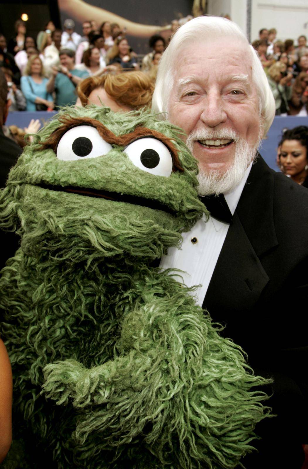 FILE PHOTO: Spinney poses with Oscar the Grouch as they arrive at 33rd annual Daytime Emmy Awards in Hollywood, California