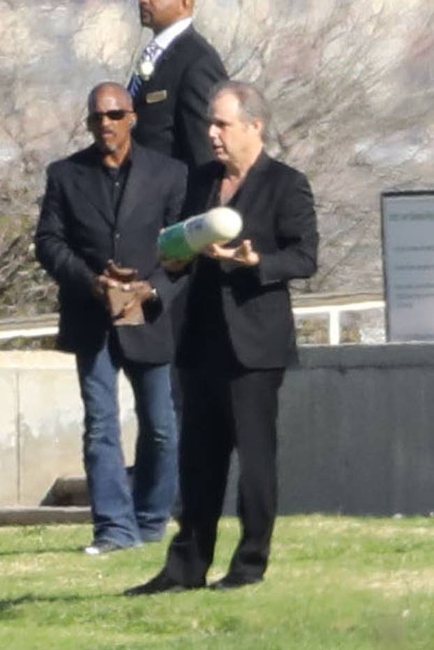 Todd Fisher carries his sister Carrie Fisher