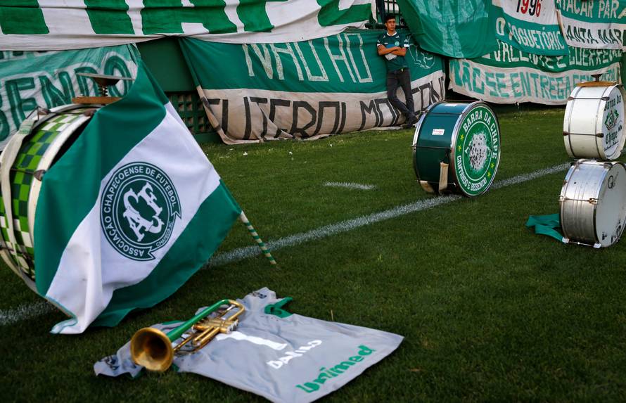 A fan of Chapecoense soccer team pays tribute to Chapecoense's players at the Arena Conda stadium in Chapeco