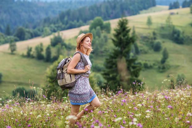 woman hiker enjoy the view at mountain