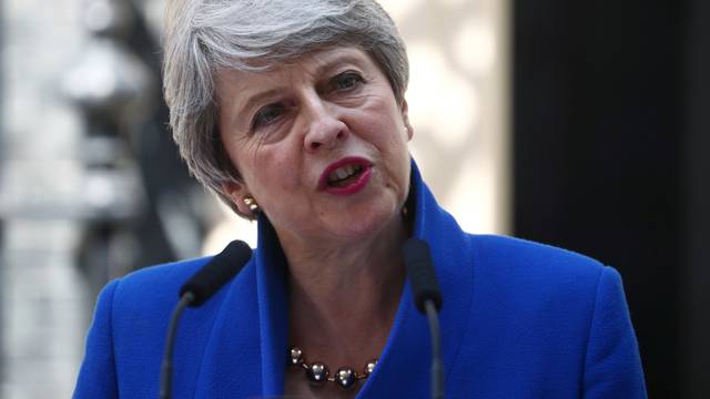 Theresa May delivers a speech on her last day in office as Britain's Prime Minister, outside Downing Street, in London