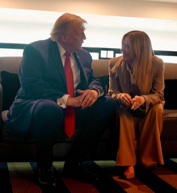 U.S. President Donald Trump speaks to Italian Prime Minister Giorgia Meloni on the sidelines of G7 summit