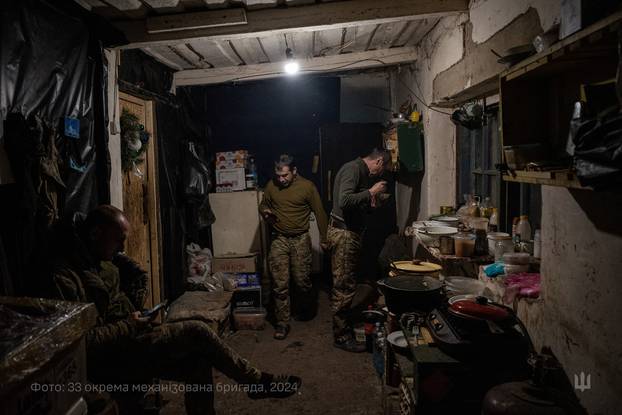 Ukrainian servicemen celebrate Christmas Eve in a front line in Dnipropetrovsk region