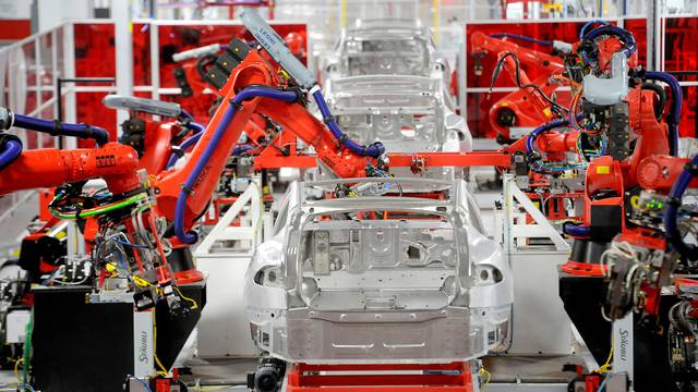 FILE PHOTO: Robotic arms assemble Tesla's Model S sedans at the company's factory in Fremont