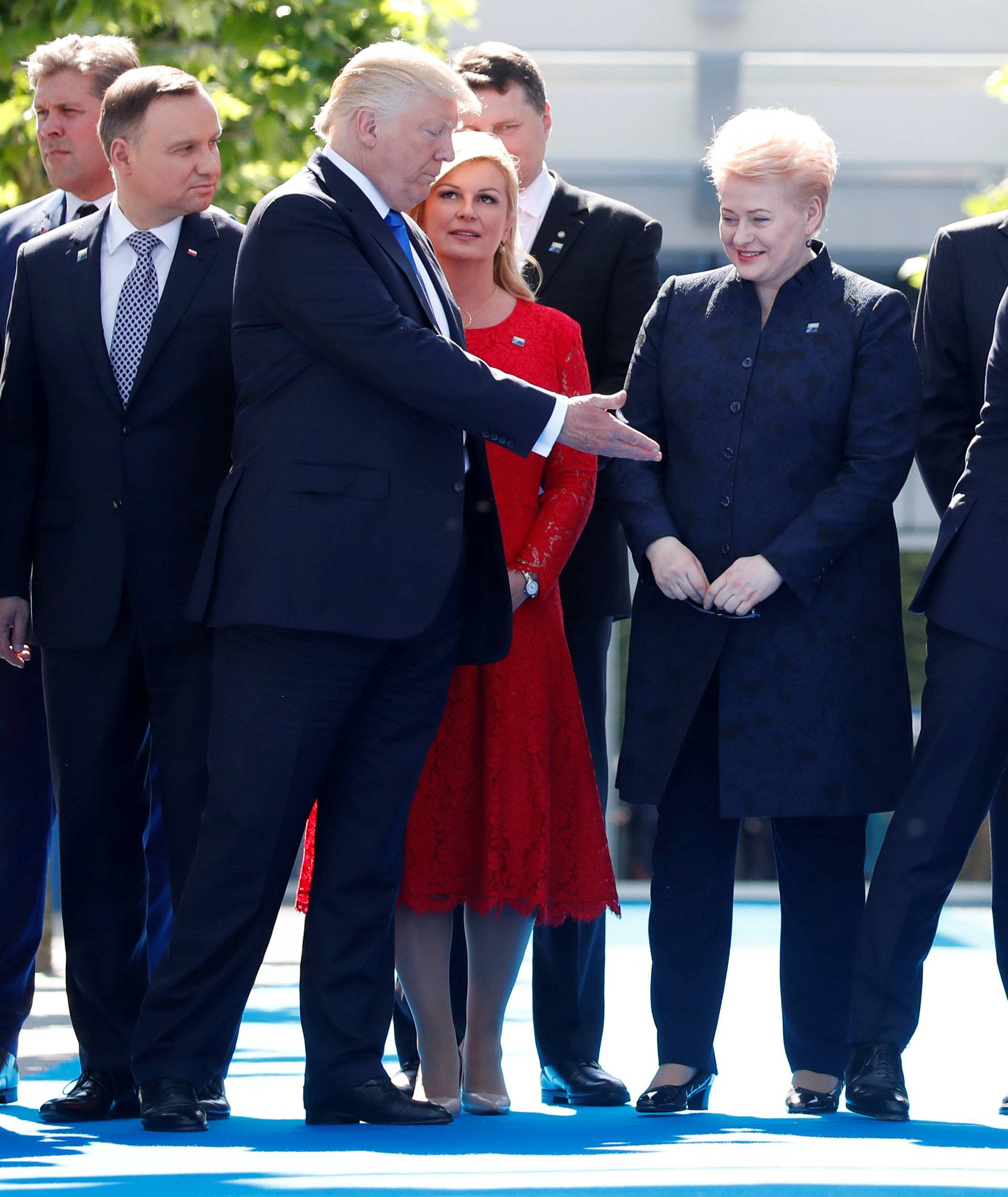 U.S. President Donald Trump and NATO member leaders gather for a family picture before the start of their summit at the new headquarters in Brussels