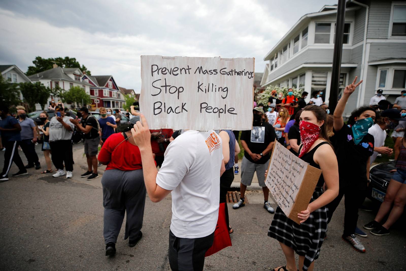 Protesters gather at the scene where Floyd was pinned down by a police officer in Minneapolis