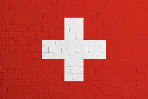 Flag of Switzerland. Brick wall texture of the flag of Switzerland