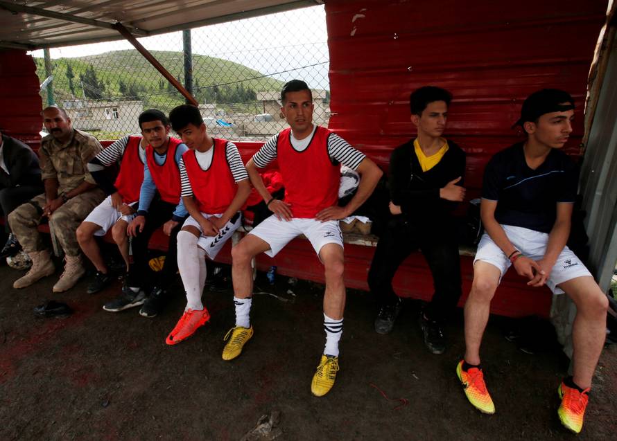 Biwar Abdullah, 25, an Iraqi Kurdish local footballer, who looks like the football player Cristiano Ronaldo, is seen at a football yard in the district of Soran, northeast of Erbil