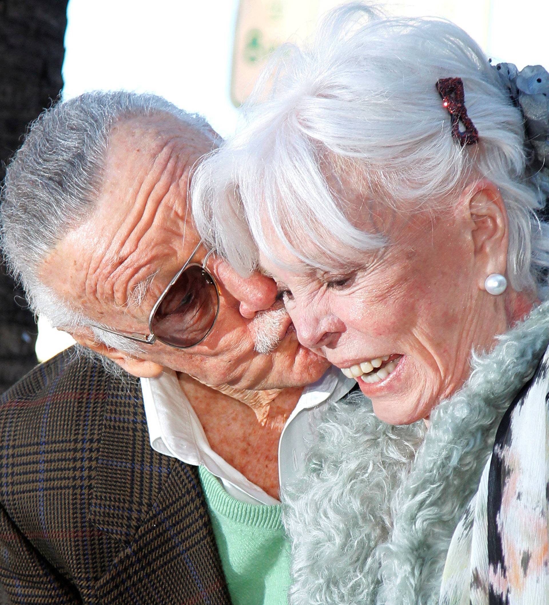 FILE PHOTO - Comic book creator Stan Lee kisses his wife Joan after she walked across his newly unveiled star on the Hollywood Walk of Fame in Hollywood