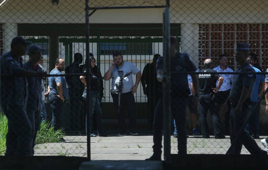 Policemen are seen at the Raul Brasil school after a shooting in Suzano