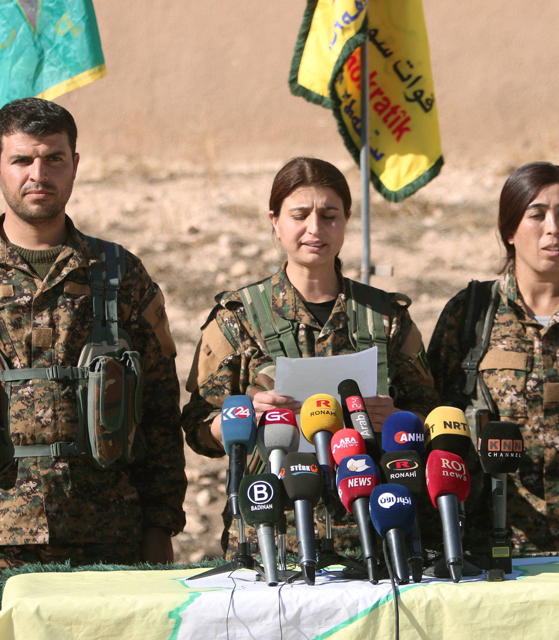 Syrian Democratic Forces commanders attend a news conference in Ain Issa