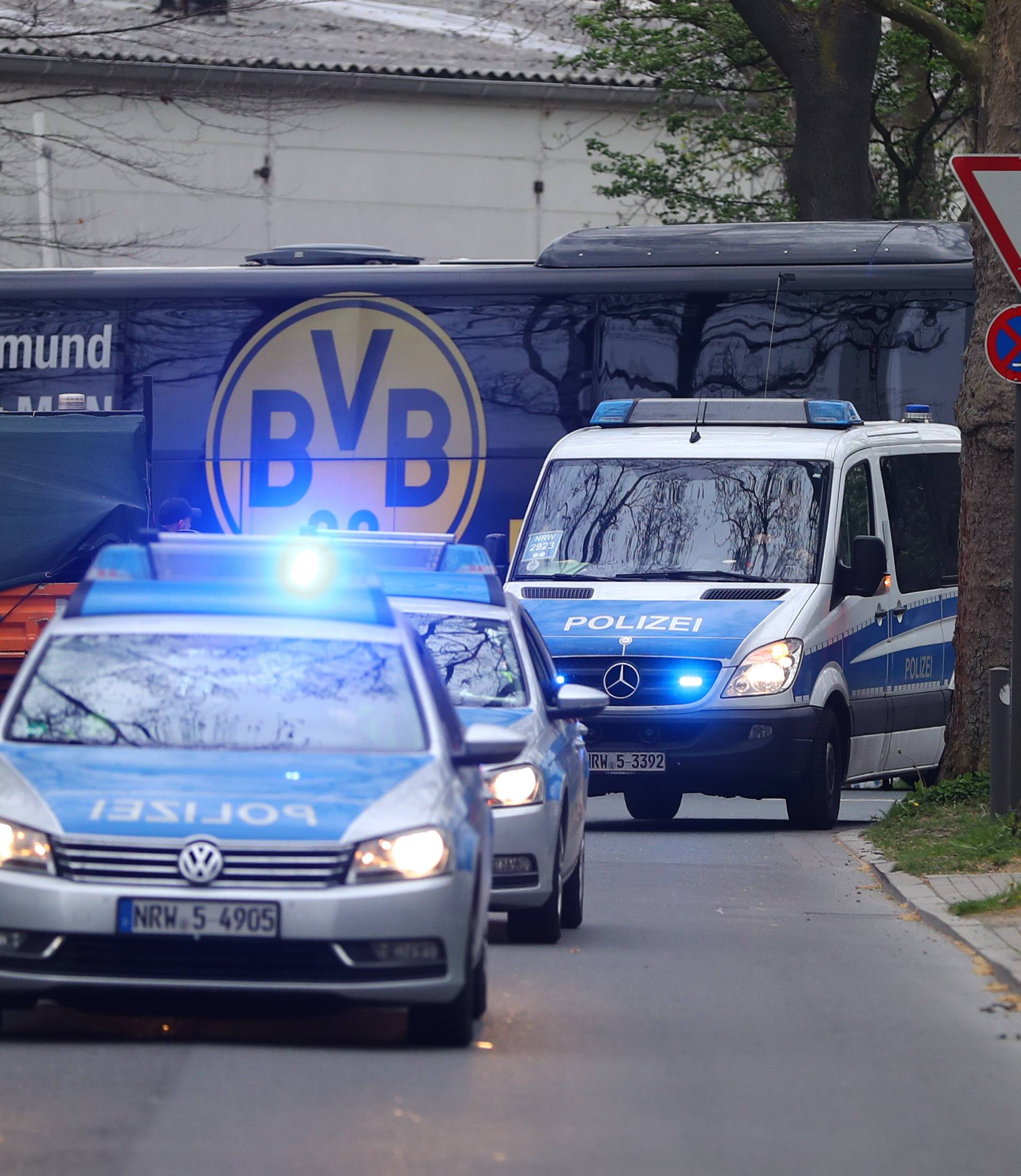 The Dortmund team bus arrives with a Police escort before the match