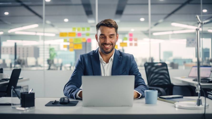 Busy,Young,Businessman,Using,Laptop,Computer,In,Modern,Office.,Manager