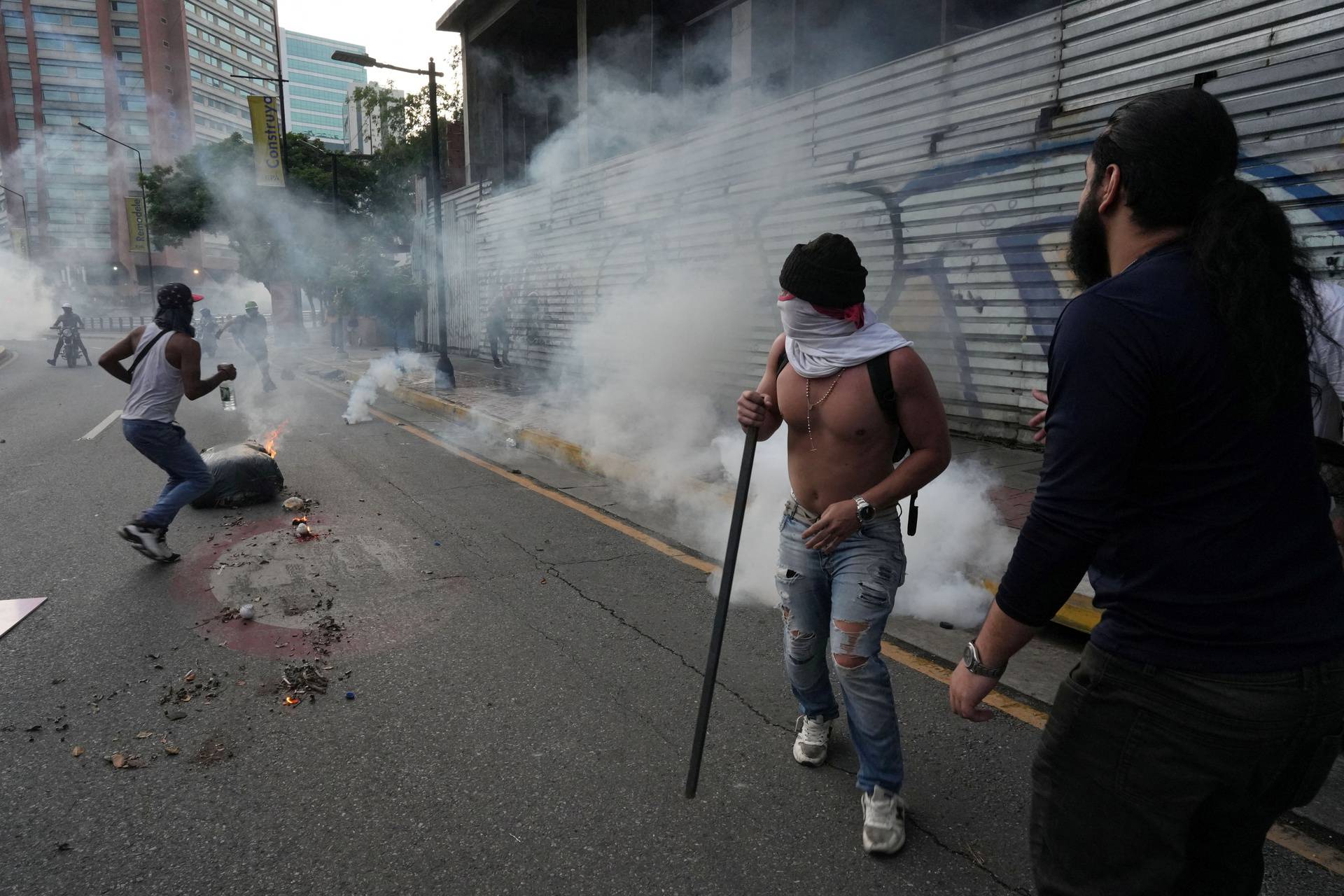 Supporters of the Venezuelan opposition demonstrate following the announcement that Venezuela's President Maduro won the presidential election, in Caracas