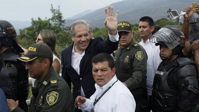 OAS Secretary General Almagro waves to people during his visit to the Colombia-Venezuela border at the Simon Bolivar international bridge in Cucuta