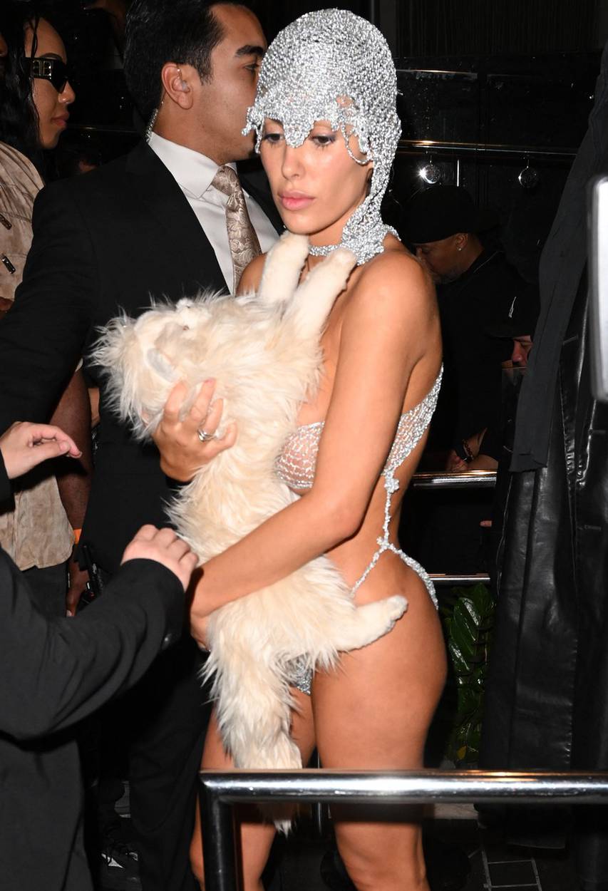 PREMIUM EXCLUSIVE: Kanye West's wife Bianca Censori is nearly naked in X-rated silver string ensemble covering up with only a stuffed cat as duo cause a stir at Miami's LIV nightclub