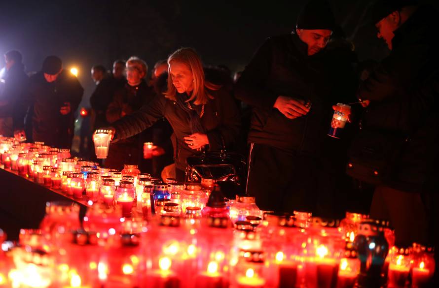 Bosnian Croats pray and light candles for the convicted general Slobodan Praljak, who killed himself seconds after the verdict in the U.N. war crimes tribunal in The Hague, in Mostar
