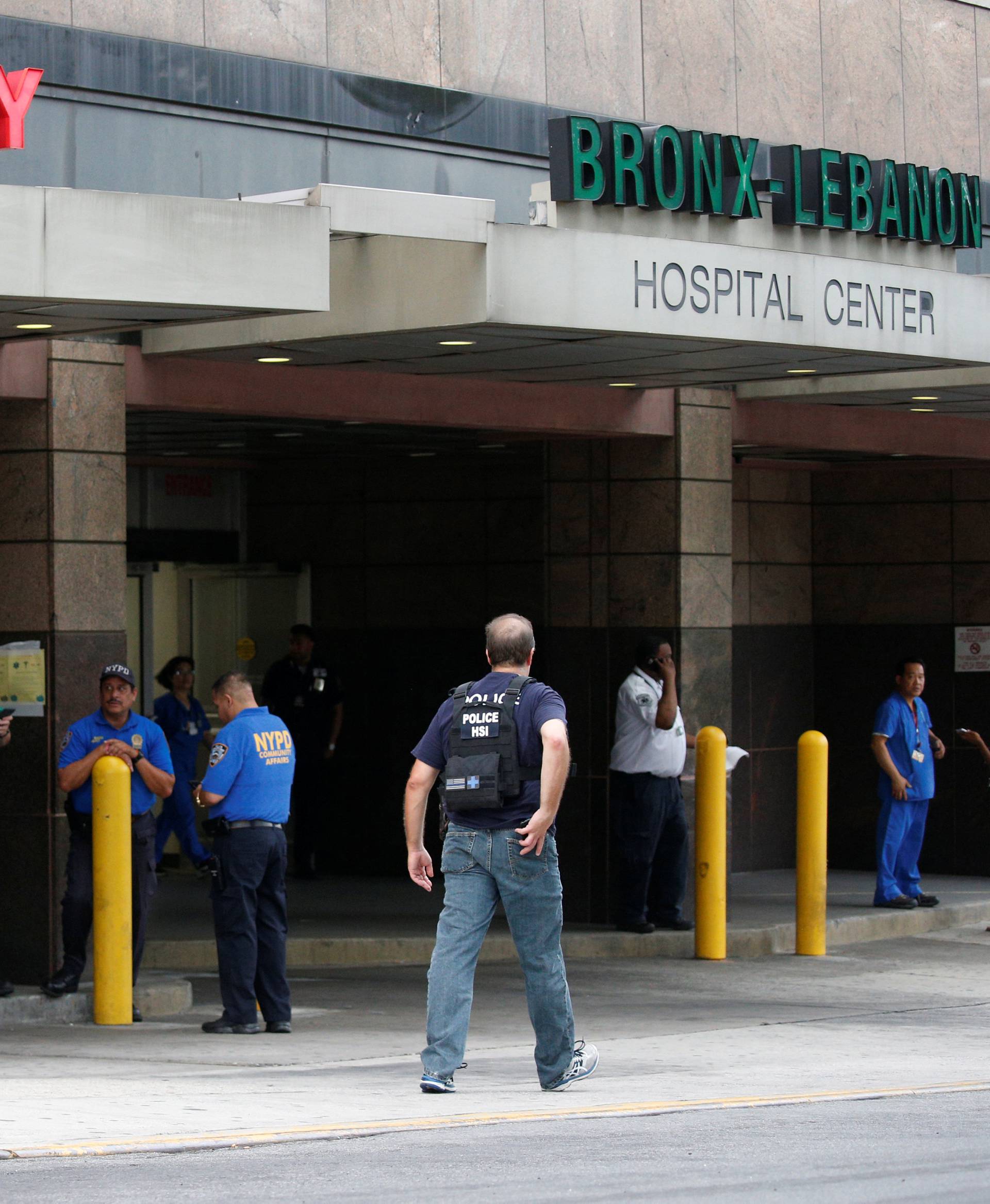 NYPD officers work outside Bronx-Lebanon Hospital, after an incident in which a gunman fired shots inside the hospital, in New York