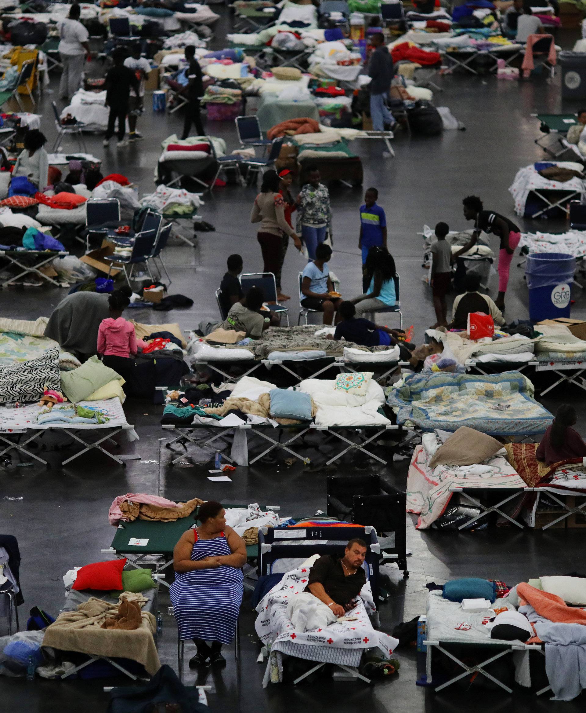 Evacuees affected by Tropical Storm Harvey take shelter at the George R. Brown Convention Center in downtown Houston