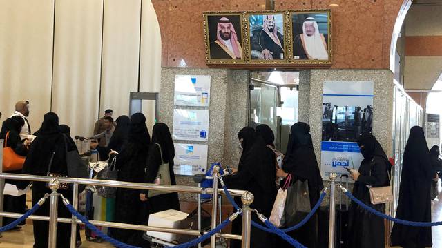 FILE PHOTO: Saudi women are seen in line as they are traveling at the Dammam railway station in Dammam