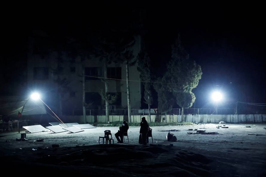 People react after a quake in Antakya in Hatay province, Turkey