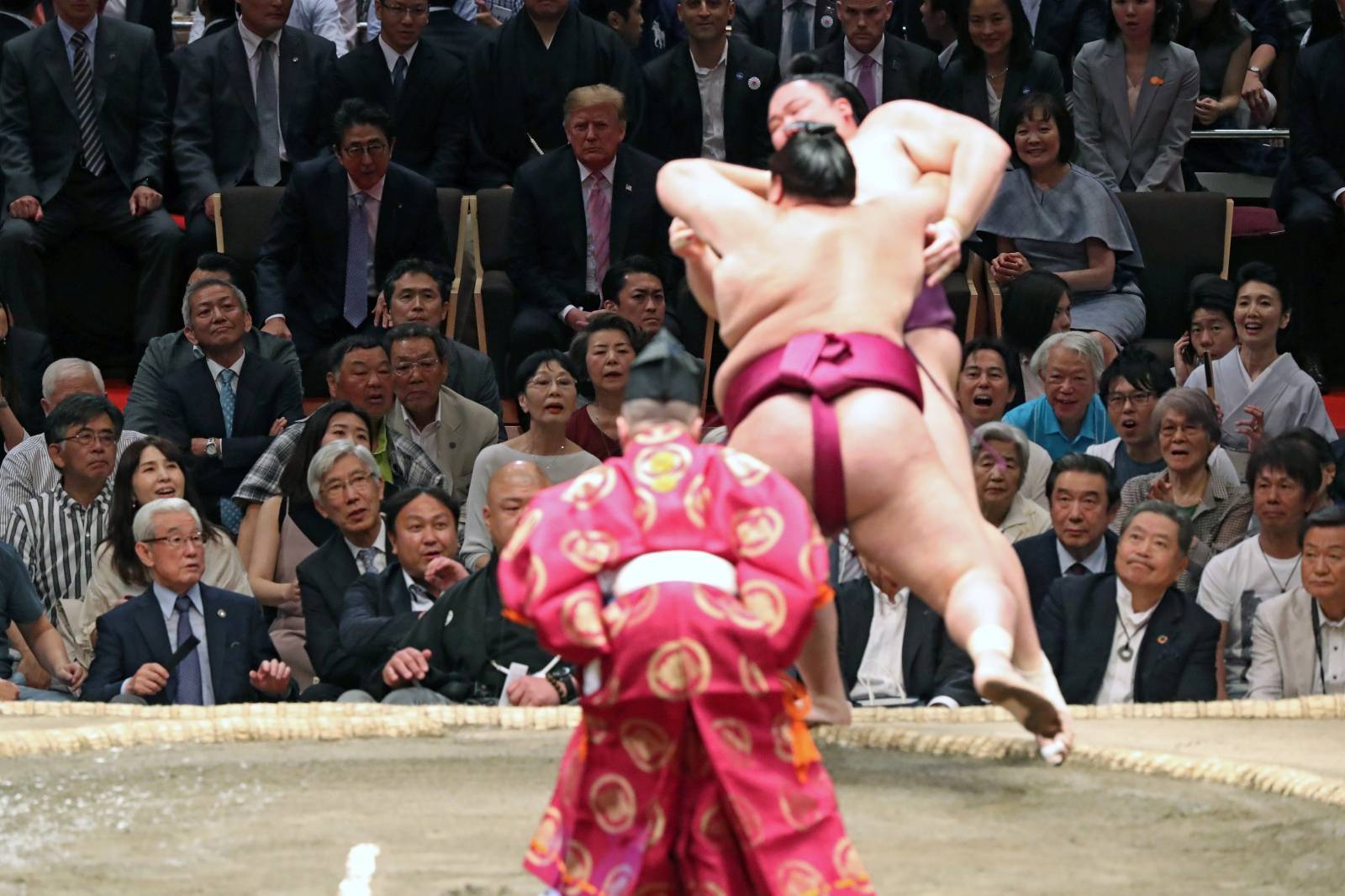 U.S. President Donald Trump, first lady Melania Trump, Japanese Prime Minister Shinzo Abe and wife Akie Abe watch the Summer Grand Sumo Tournament at Ryogoku Kokigikan Sumo Hall in Tokyo